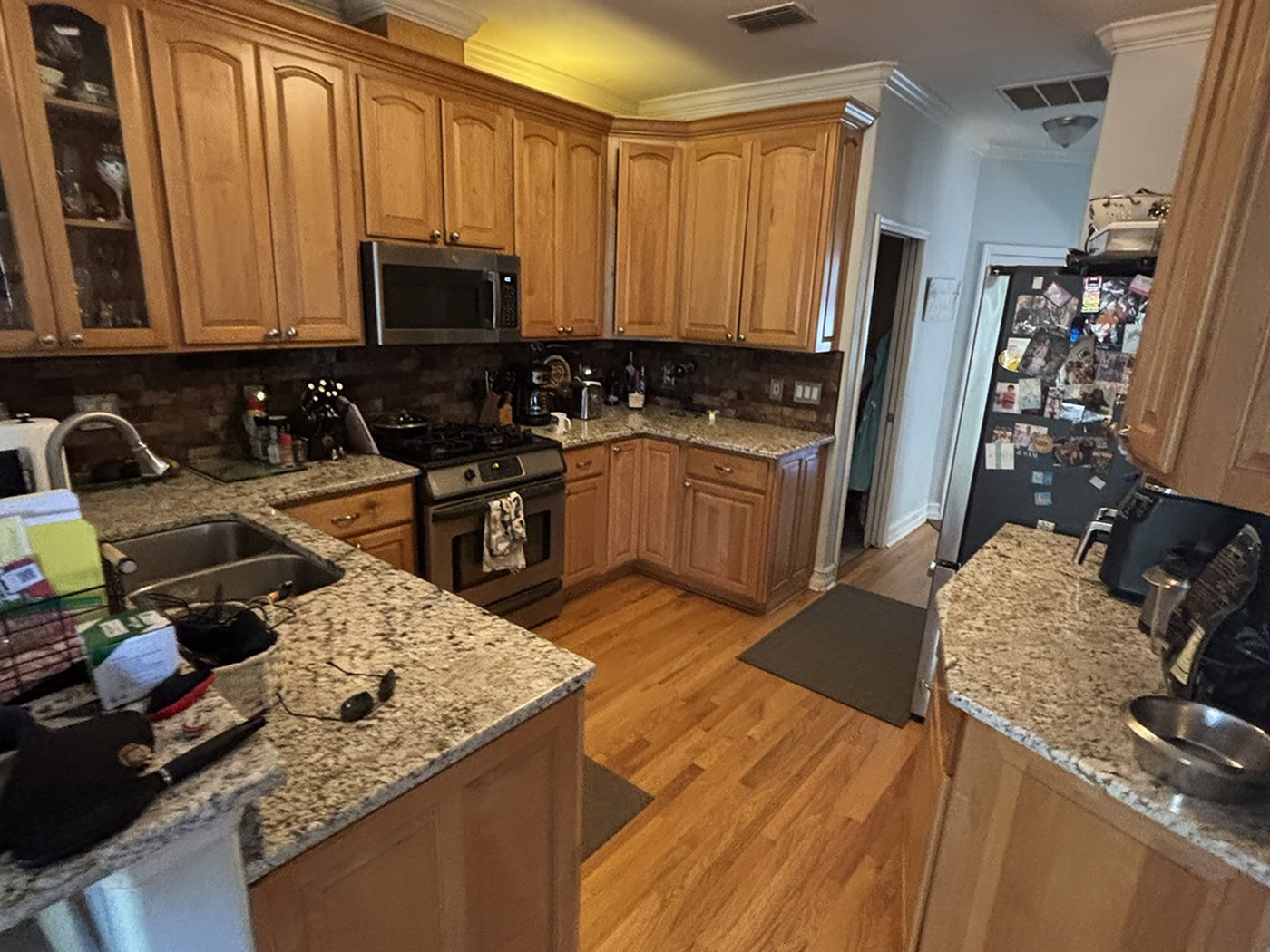 Conservancy Before Kitchen 01 Ba The original kitchen before renovation, with honey oak raised-panel cabinets and speckled granite counters