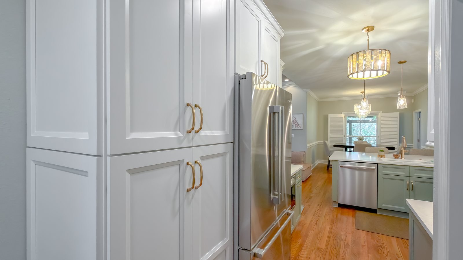 Renovated kitchen with island seating and pendant lighting. Tallahassee, Florida.