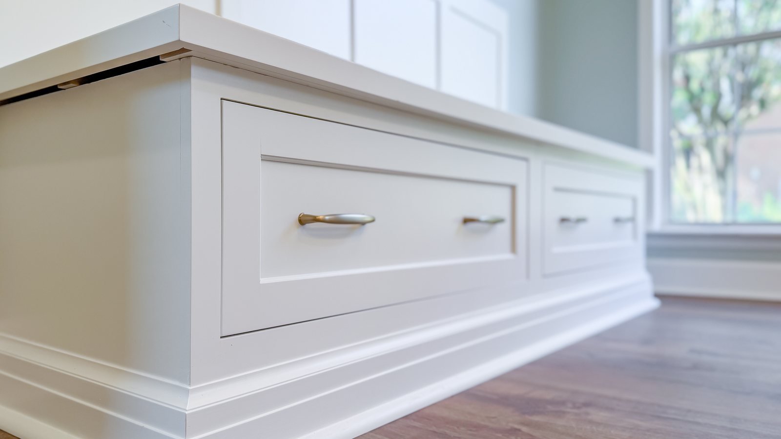 Custom millwork with a continuous top and brass pulls. Major interior renovations Tallahassee, FL.