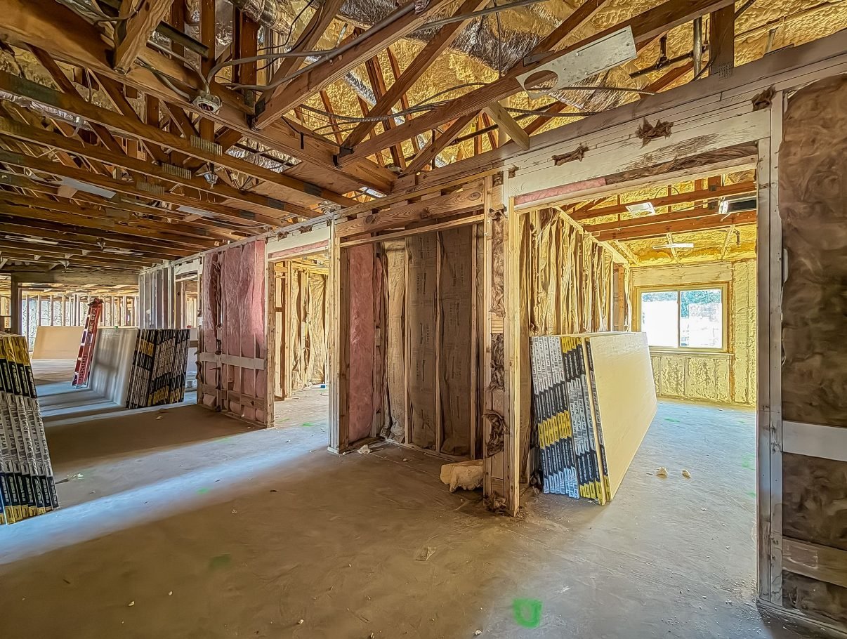 Interior of a house taken back to studs and insulation during a whole-home renovation. Tallahassee, Florida.