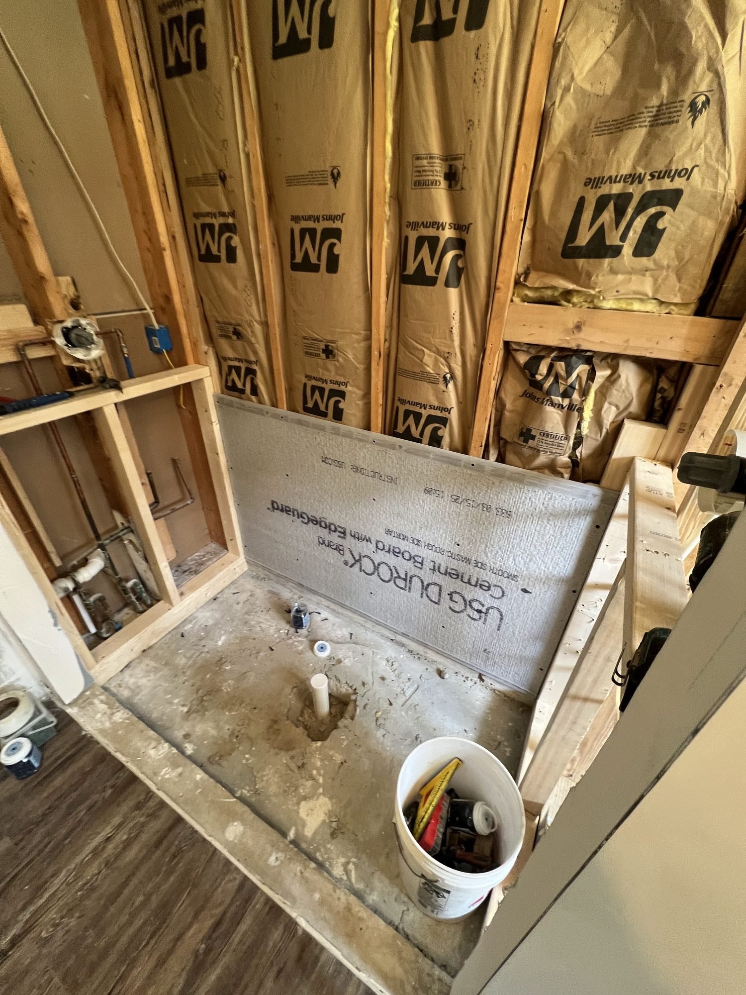 A shower pan and cement board substrate being built before waterproofing and tiling, Tallahassee, FL