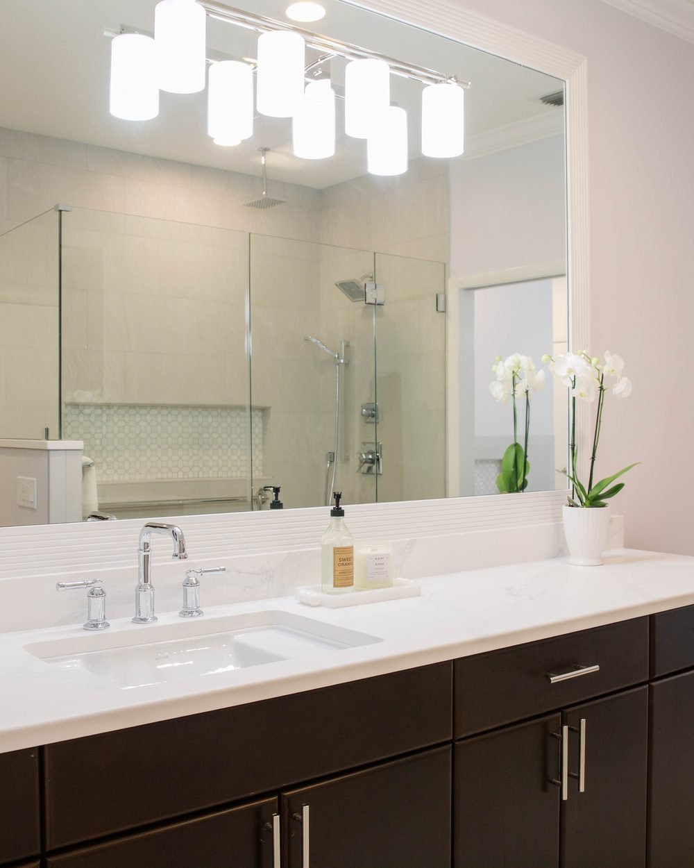 Bathroom with a dark espresso double vanity and white quartz counter in Tallahassee, FL