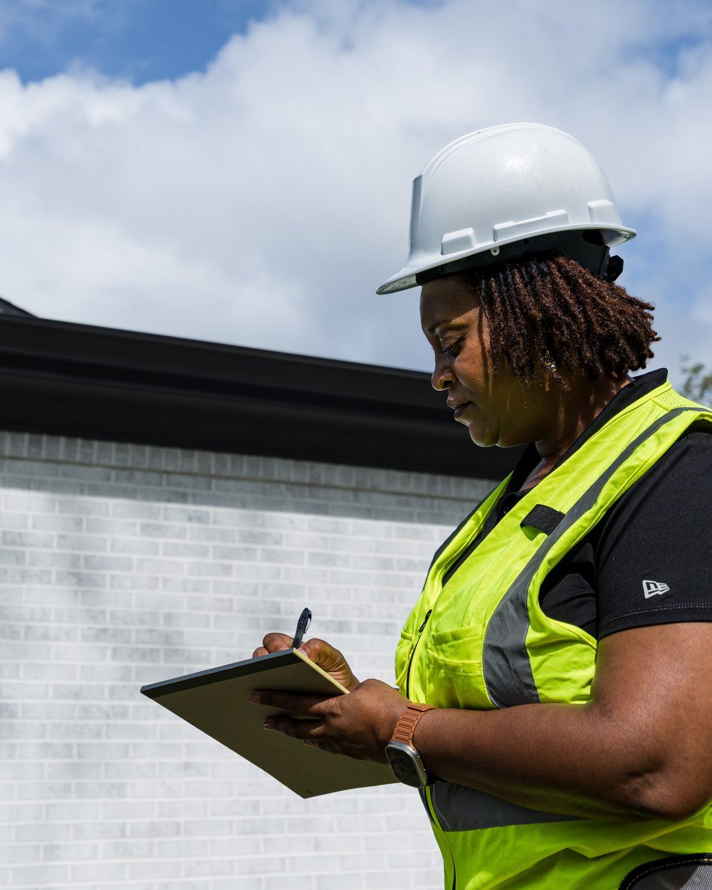 Pristine team member making notes on a clipboard during a site visit